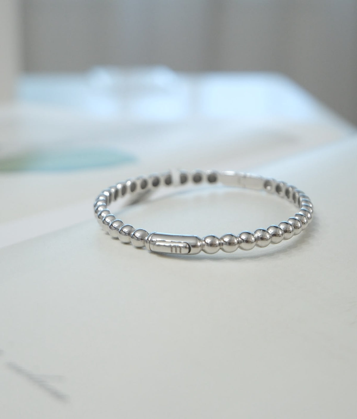 Pulsera bolitas oro blanco