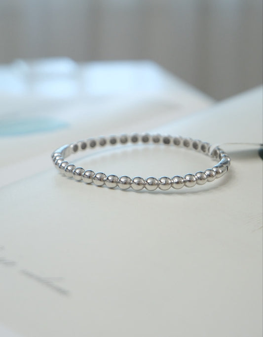 Pulsera bolitas oro blanco